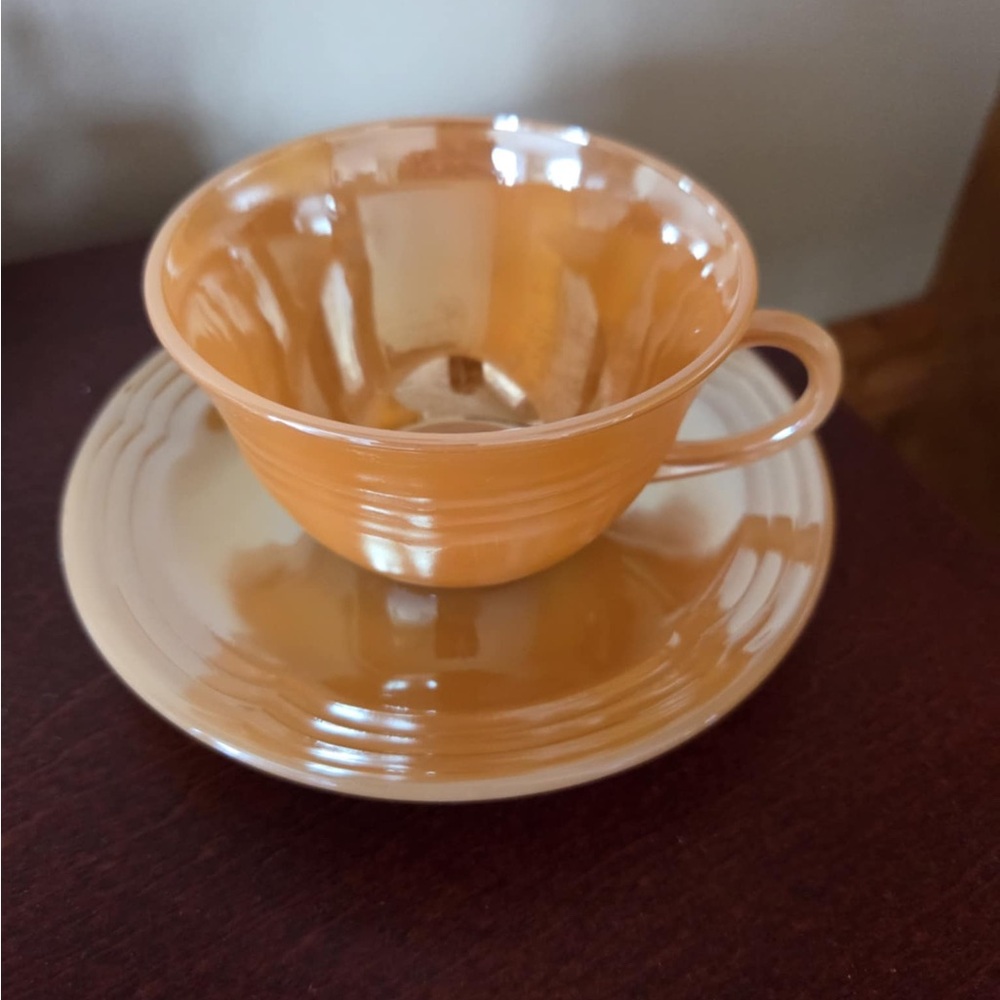Vintage Fire-King peach lustre tea cup and saucer